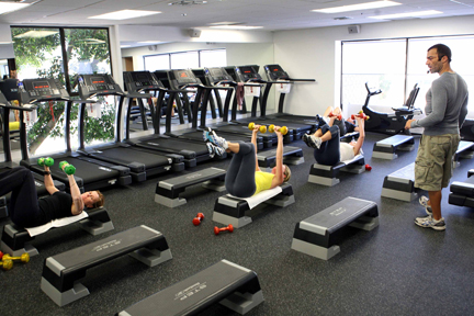 Exercisers work out at BodyCamp, a new gym located in the Atrium Building on Via de la Paz.
